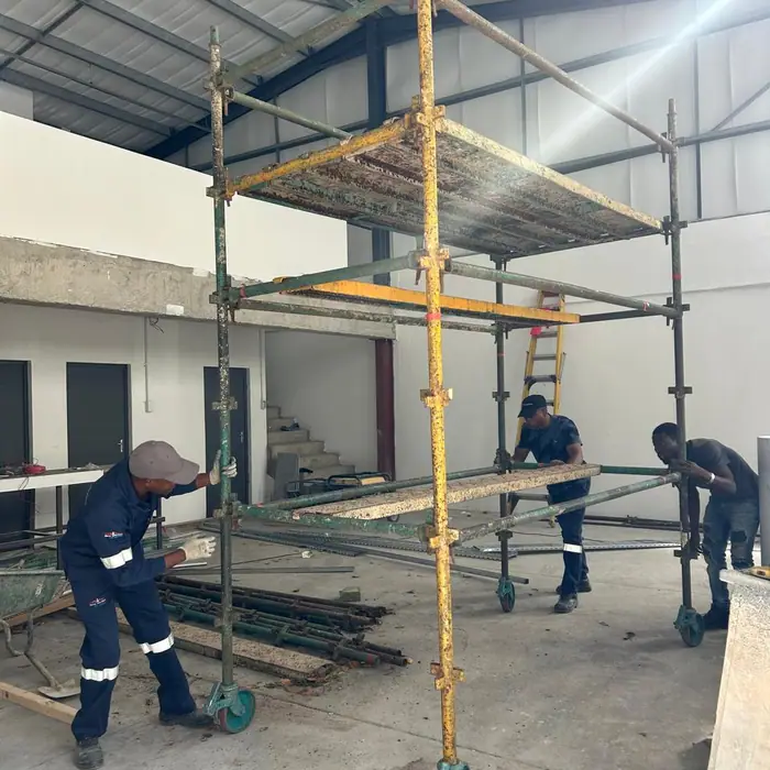 Team erecting scaffold for an install